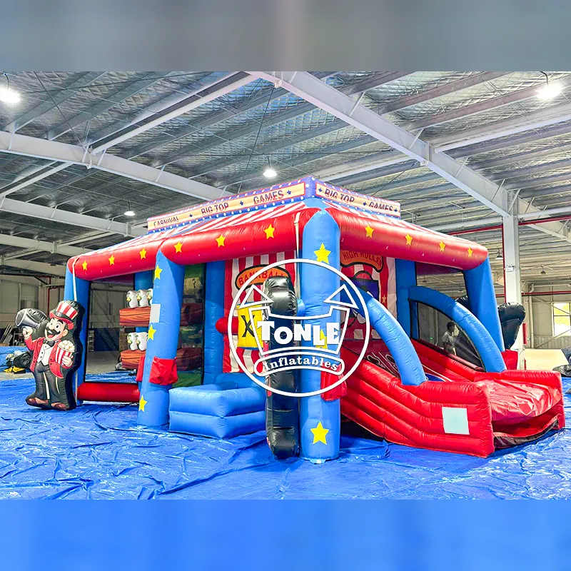 Front view of 7.35m 6 in 1 inflatable carnival game with red white blue big top roof and ringmaster figures