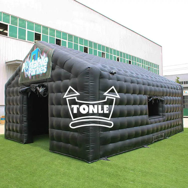 Black inflatable bar tent with quilted texture and Tonle logo on grass