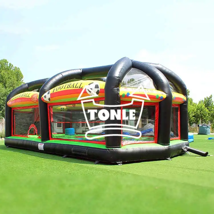 11m inflatable multi-purpose sports court with black arches and red yellow green panels on grass