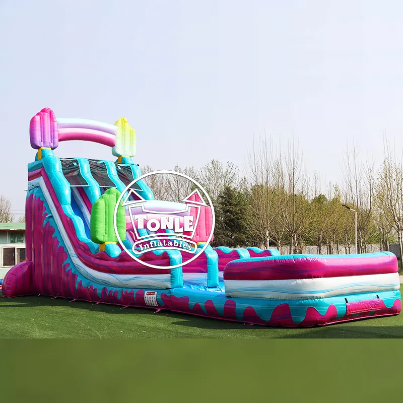 23ft pink and blue inflatable water slide with popsicle decorations and dual lanes