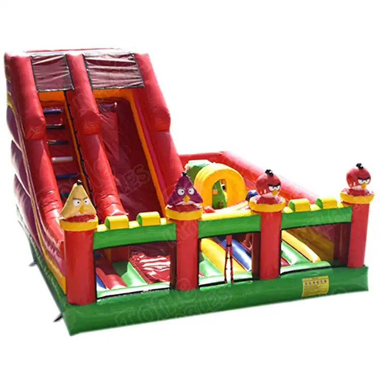 Red and green Angry Birds inflatable playground with dual slide and character turrets