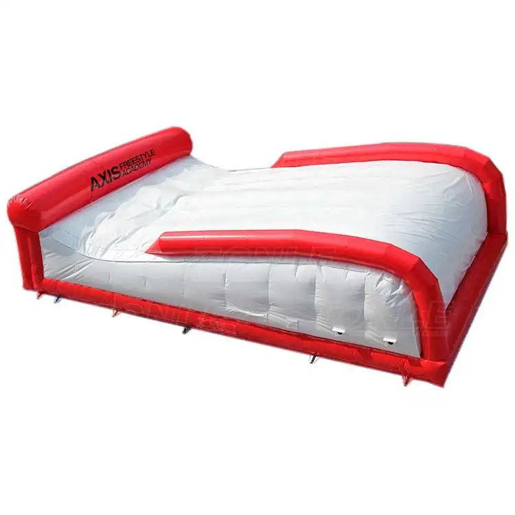 Red and white 10.5m inflatable ski big air bag with Axis Freestyle Academy logo