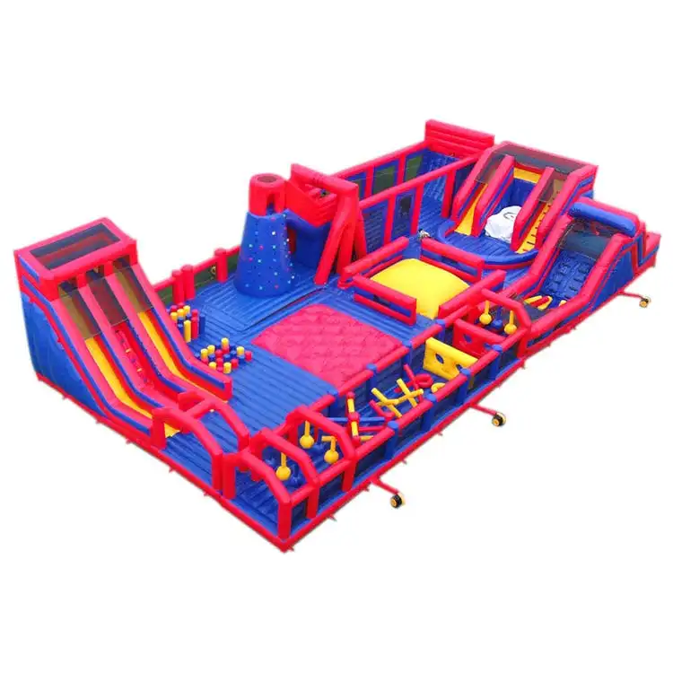 Red and blue 30x15m inflatable fun park with dual slides and climbing wall