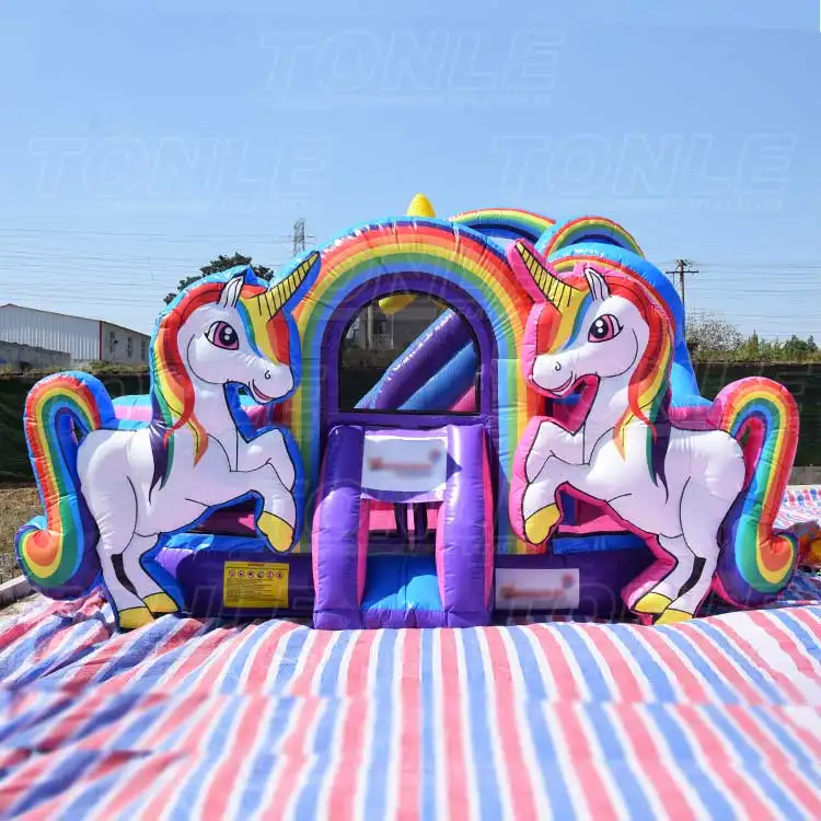 Front view of 5.58m unicorn inflatable playground with rainbow arch and two white unicorns