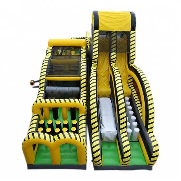 Yellow and black nuclear-themed inflatable obstacle course with dual slide lanes