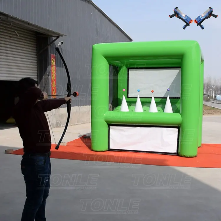 Green inflatable archery tag game with four white cone targets and colored balls, 3x2.4x3m size