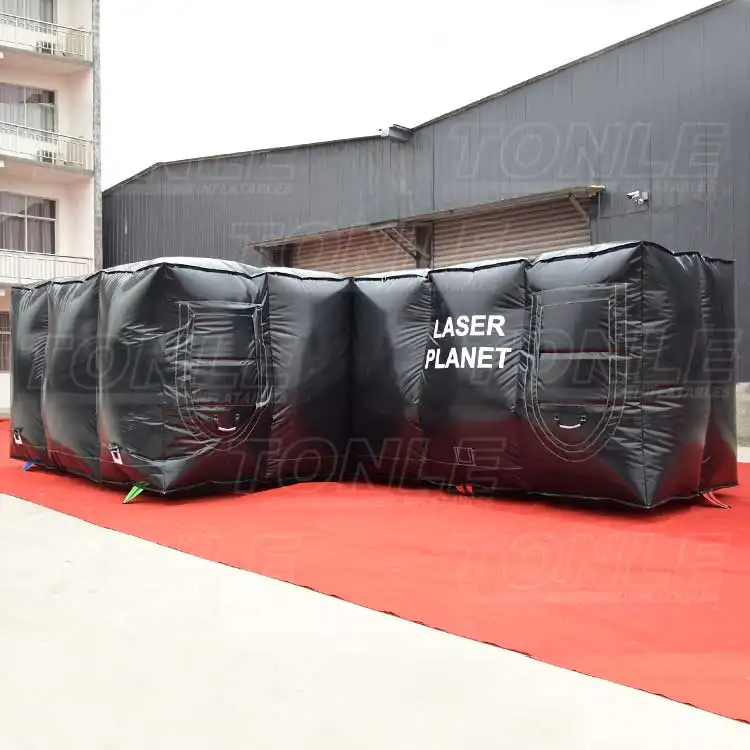 Black inflatable laser tag arena with white 'LASER PLANET' text on side panel