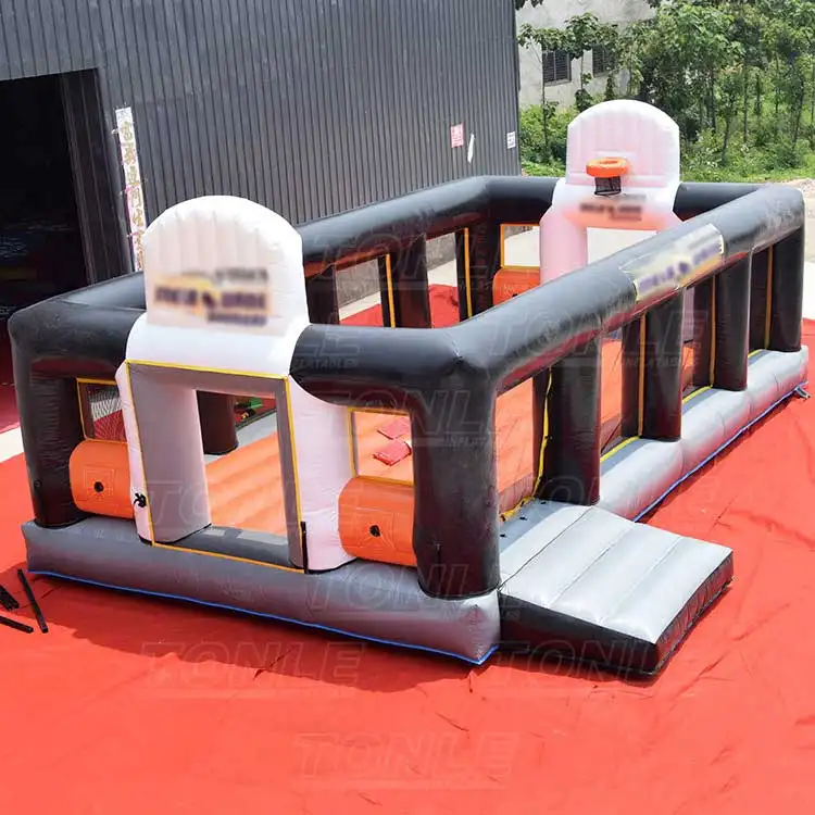 Black and orange Inflatable Basketb Area with dual hoops and mesh walls
