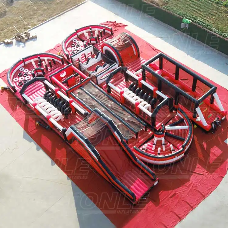 Aerial view of 24m red and black dotted inflatable obstacle course with dual lanes