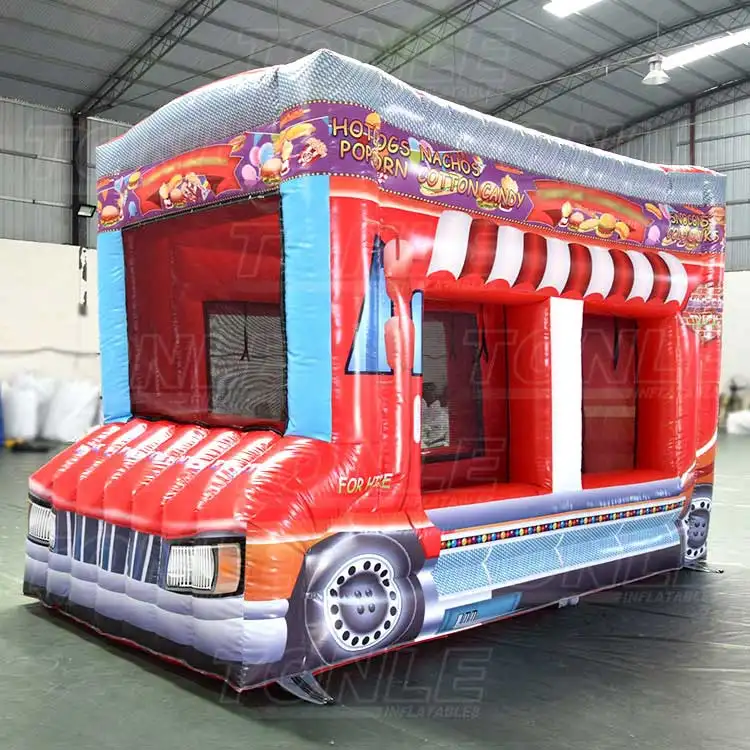 Red inflatable carnival car food truck booth with striped awning and menu graphics