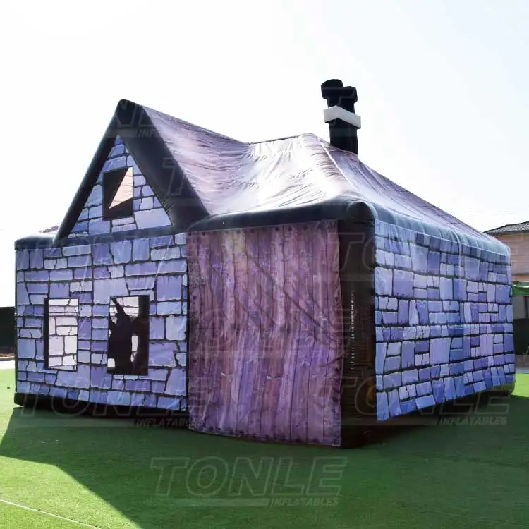 7x7m inflatable pub tent with purple stone wall print and black roof trim on green turf