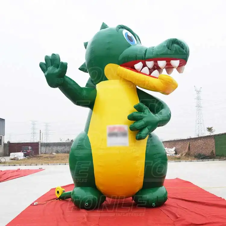 5m tall green and yellow inflatable dragon waving hand on red carpet