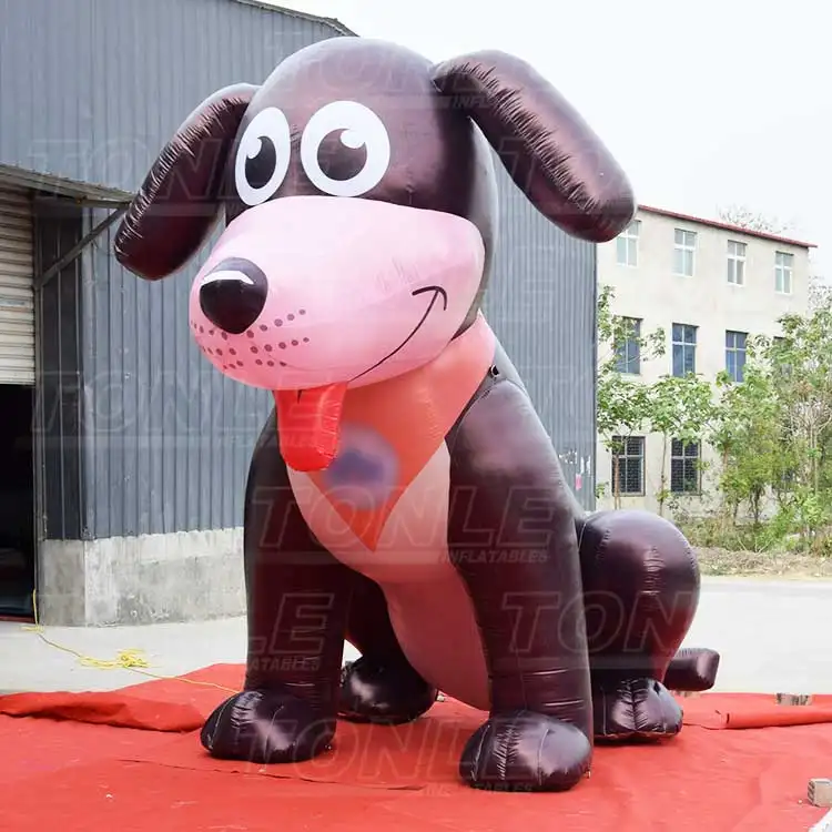 4m tall giant inflatable dog with dark brown body and pink snout sitting on red carpet
