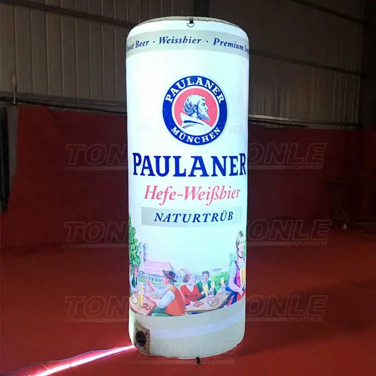 2.5m giant inflatable Paulaner beer bottle replica with internal LED lighting glowing on a red floor