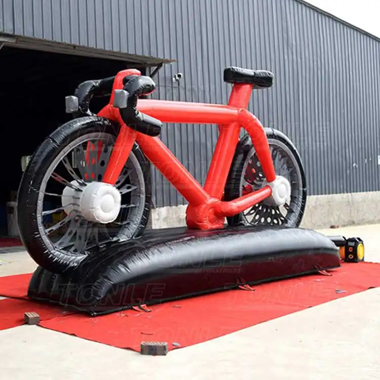Giant red and black inflatable road bike replica measuring 6 meters long on a black base