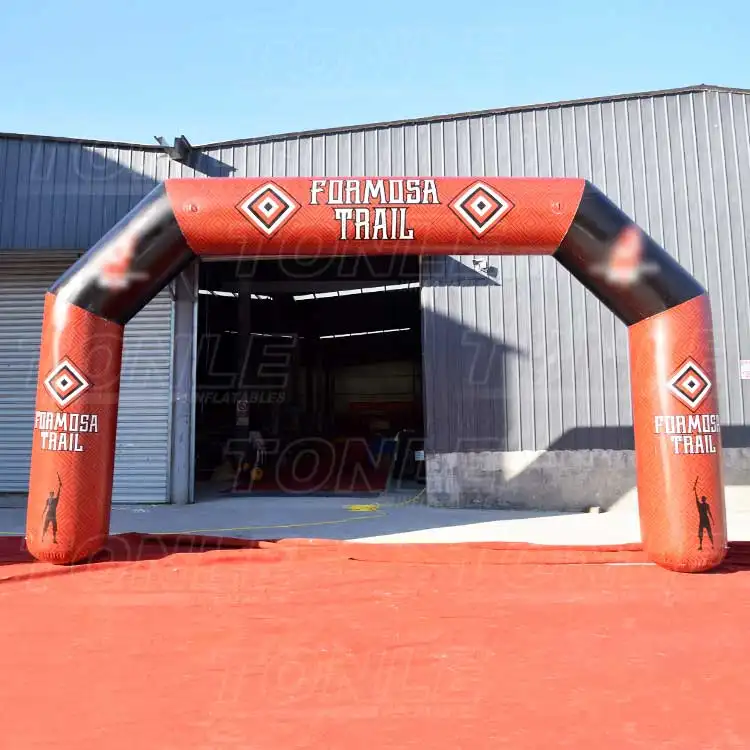 Red and black 7x4m inflatable arch with Formosa Trail branding and diamond patterns