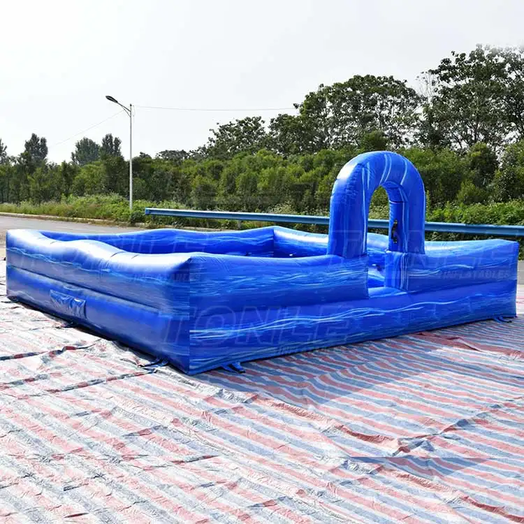 Blue inflatable foam pit with wave pattern and arch entrance on striped ground