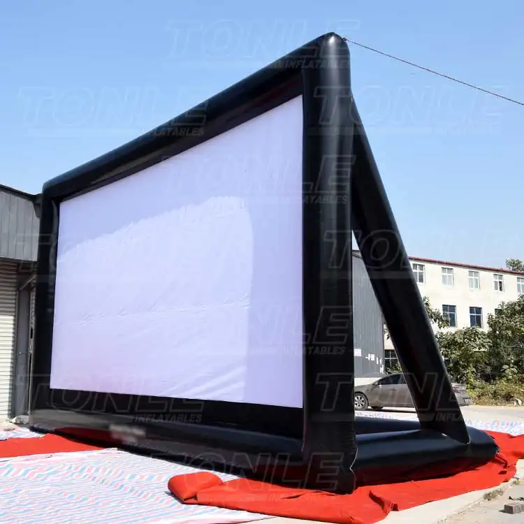 Large 10x6m black inflatable movie screen with white projection surface set up outdoors