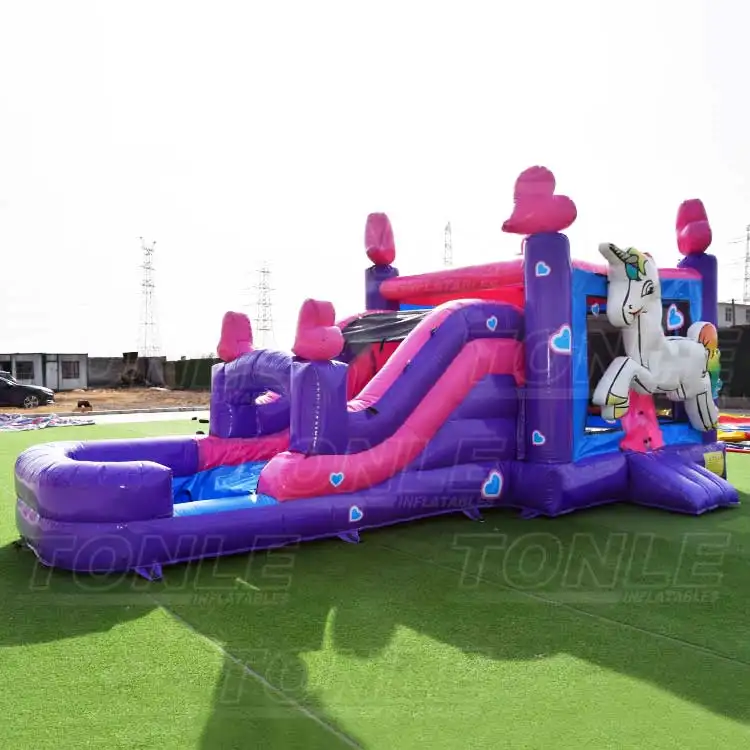unicorn bouncy castle with slide — photo 1