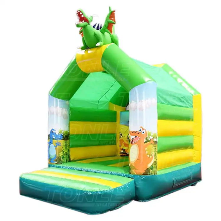 Green and yellow inflatable bouncy castle with 3D dragon on roof