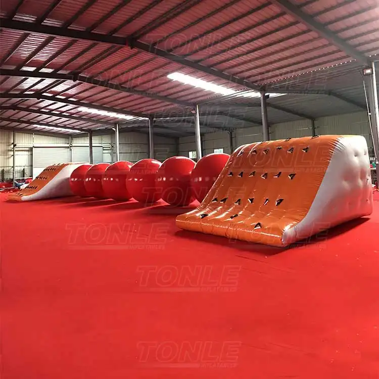 big red inflatable ball obstacle water games — photo 1