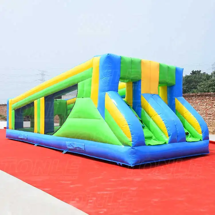 Blue, green, and yellow 9m inflatable zipline with dual lanes on red ground