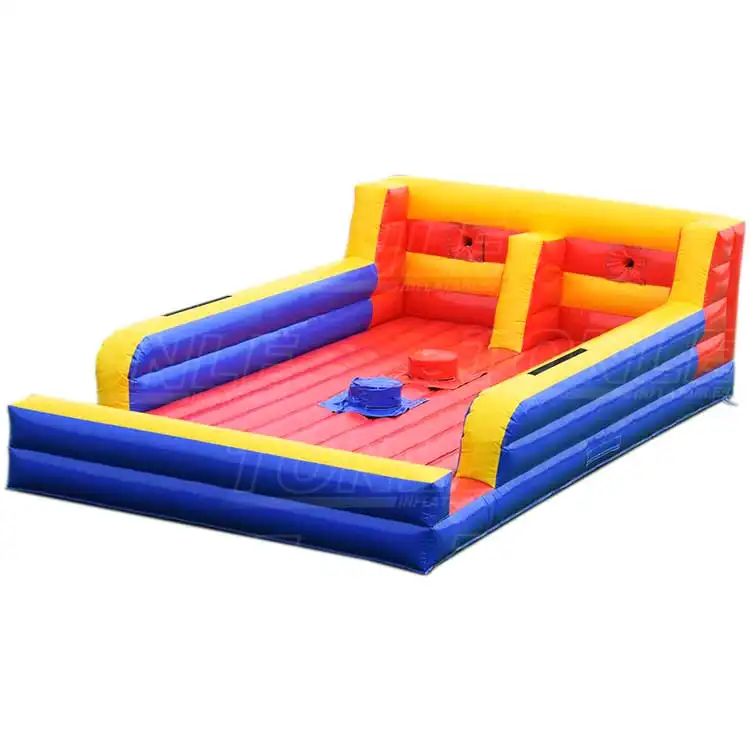 Red blue and yellow inflatable bungee and joust combo game viewed from angle