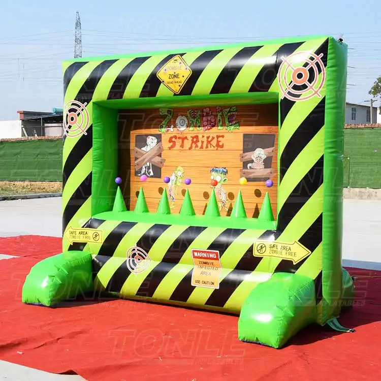Inflatable Zombie Strike carnival game with green and black hazard stripes and target graphics