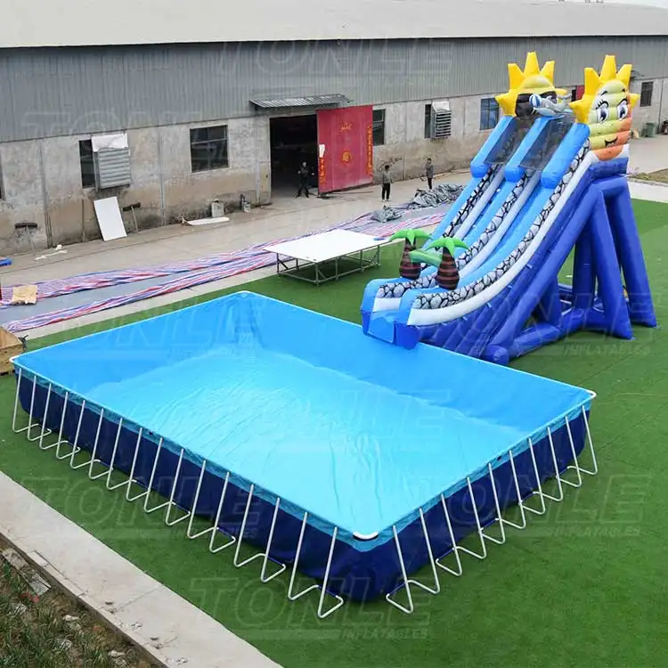 Large blue rectangular inflatable water pool with white metal frame supports on green turf