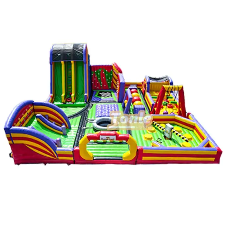 Rainbow childhood theme fun city inflatable park showing slide and obstacle course in red yellow green and blue
