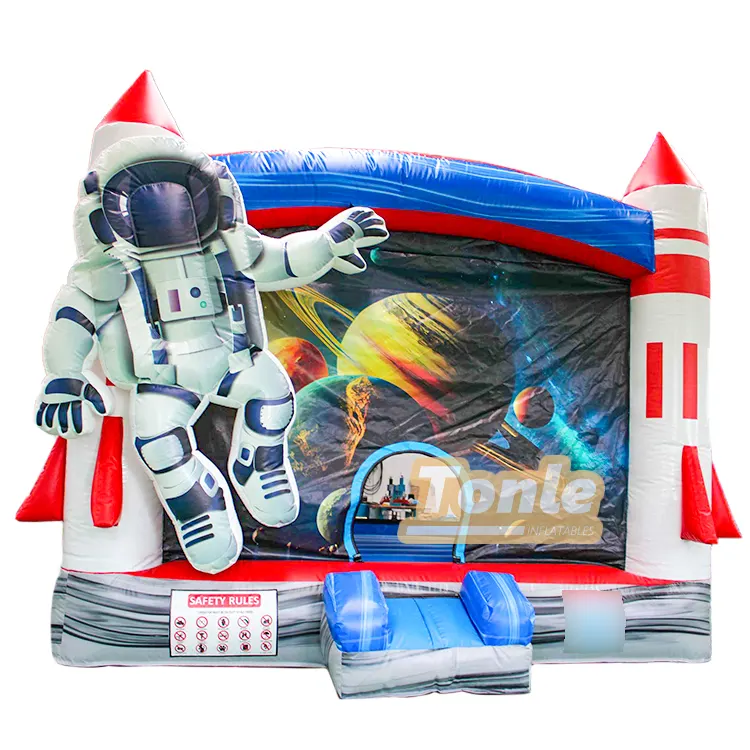 Navigating the Universe bounce house featuring a large 3D astronaut and rocket pillars in red white and blue