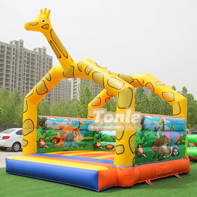Yellow giraffe themed bouncy castle with jungle animal side walls and blue orange floor