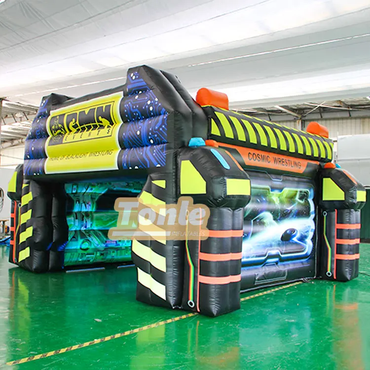 Black and neon yellow inflatable wrestling arena with cosmic graphics measuring 4.8x6.3m