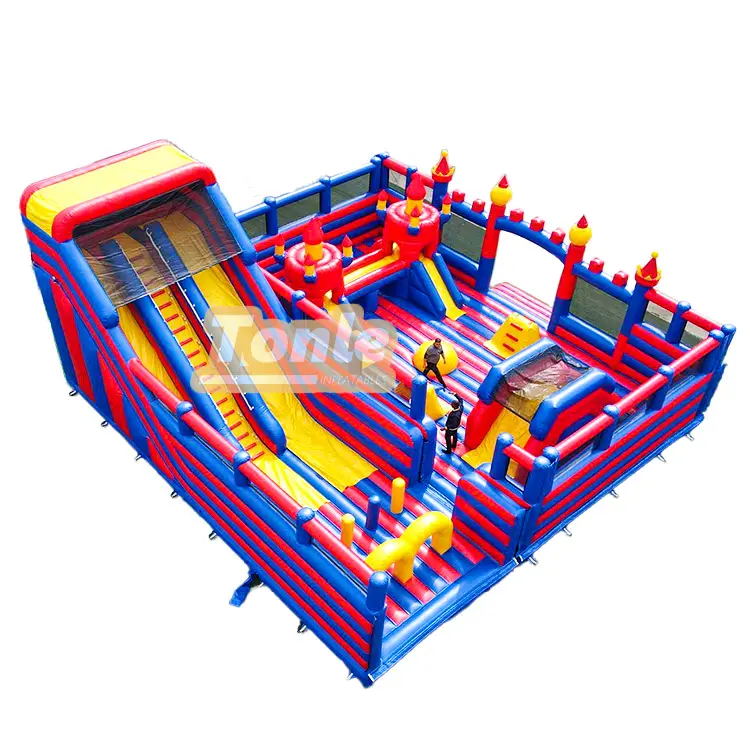 Red blue and yellow inflatable fun park with dual slides and castle turrets 13.4m size