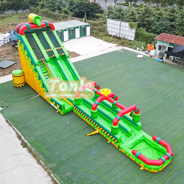 Aerial view of 64ft green and yellow poisonous theme dual lane inflatable water slide with red pipe obstacles