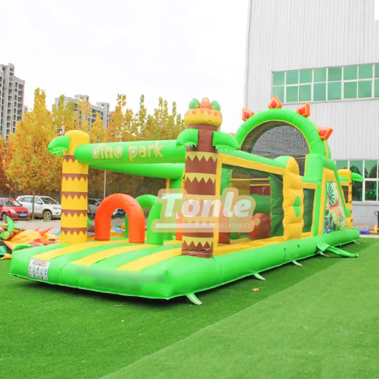 Green and yellow Jungle Dinosaur Obstacle Course with dino park sign and palm tree columns