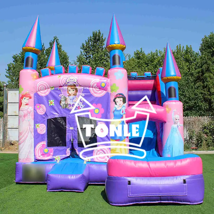 Purple and pink princess castle inflatable water slide combo with blue turrets on grass