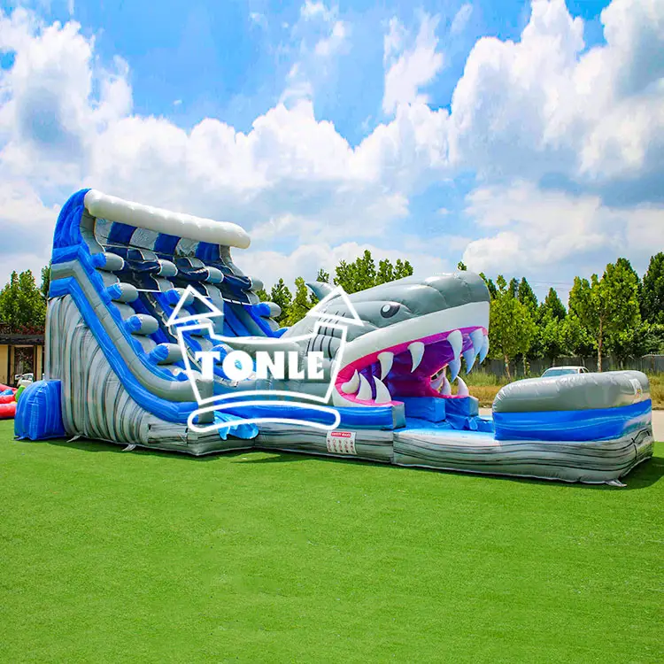 18ft grey shark dual lane water slide with blue chutes on green grass