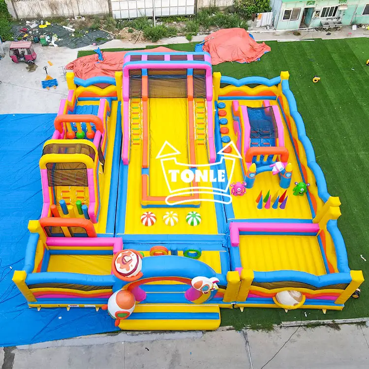 Aerial view of 16x16m Rocket and Planet Theme Inflatable Game Park with yellow floor and blue pink borders