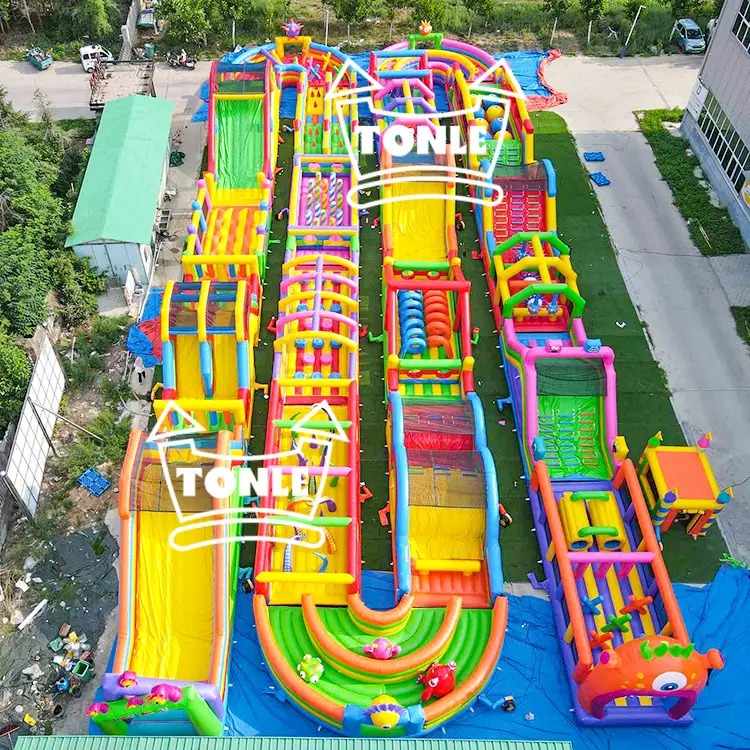 Aerial view of 50m Lively Little Monsters inflatable obstacle course with 4 colorful racing lanes