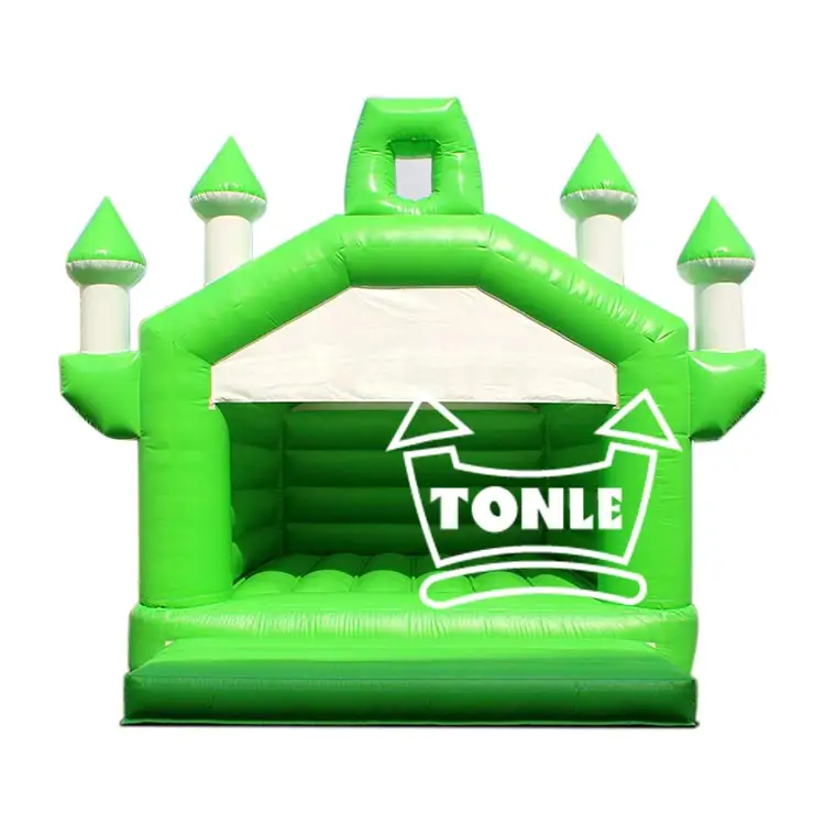Front view of green inflatable castle with four white turrets and green spires