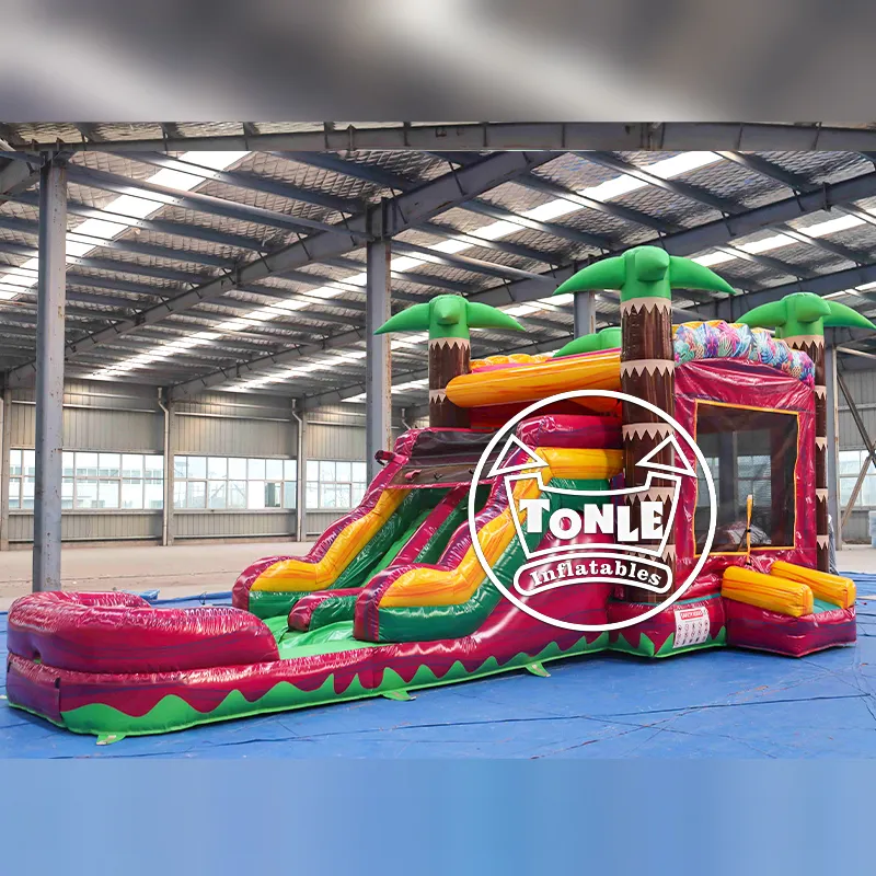 Tropical Palm Single-Lane Water Slide Combo featuring green palm trees and magenta base in a warehouse setting