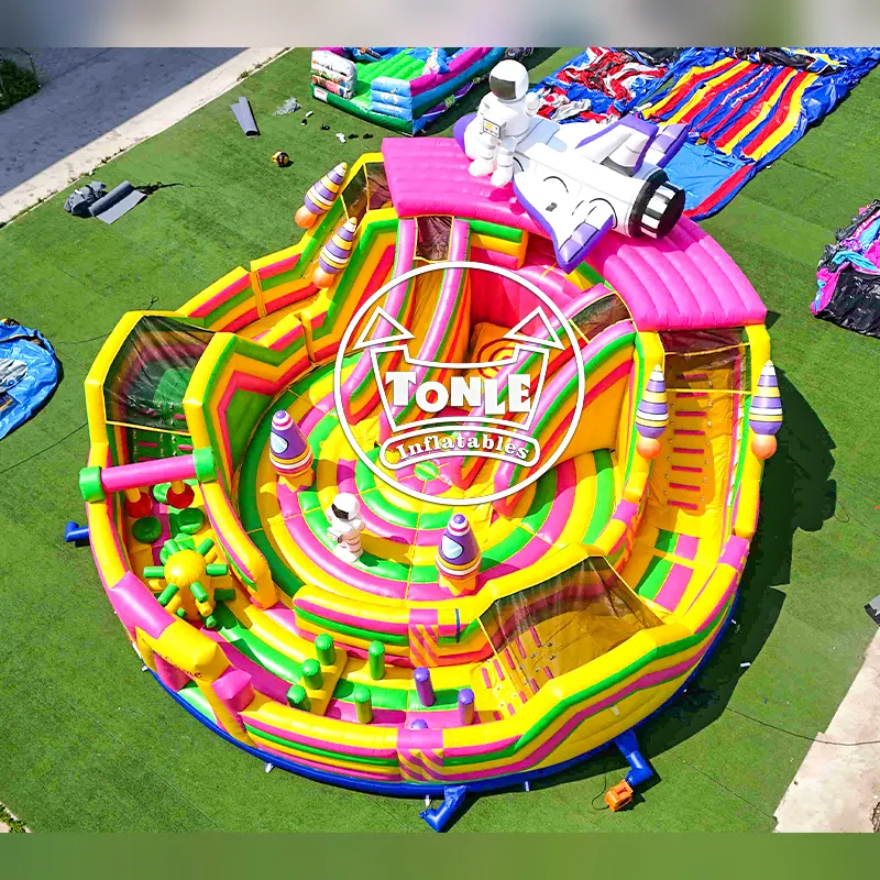 Aerial view of 14m colorful inflatable astronaut maze with spaceship topper
